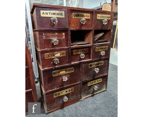 A pair of 19th Century mahogany chemist's drawers each containing thirteen drawers labelled ANTIMINIC, R GENTIAN, S.RAPIL and