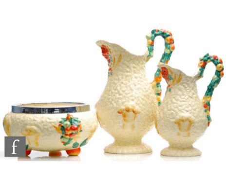A Clarice Cliff, Newport Pottery Celtic Harvest jug&nbsp;of footed baluster form, relief moulded with corn, fruit and foliage
