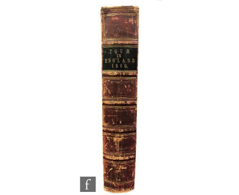 A bound manuscript titled 'Tour in England 1860', red calf boards with numerous relevant engraved and photographic illustrati