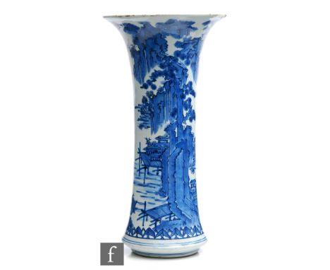 A 19th Century Chinese blue and white sleeve vase, decorated in the Kangxi style with rockwork and mountainous riverside land