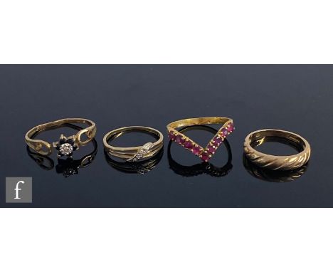 Three 9ct hallmarked modern rings, two stone set, total weight 3.8g, with an 18ct ruby set wishbone ring, weight 2.3g, ring s