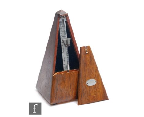 A Maelzel metronome in mahogany case, height 23cm. 