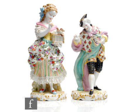 Two 19th Century Dresden type figures, the first modelled as a lady with patterned dress with a Dresden lace trim, holding a 