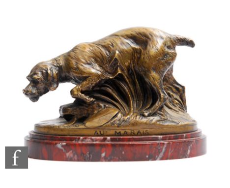 A 19th Century French bronze figure 'Au Marais' (at the swamp), by Louis-Albert Carvin, modelled as a working dog amongst ree