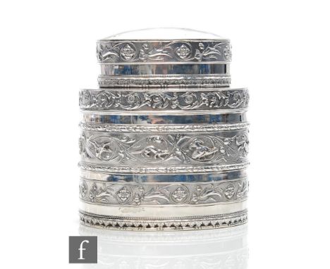 A hallmarked silver oval tea caddy with banded embossed foliate scroll decoration to body and pull off cover, weight 6.6oz, h