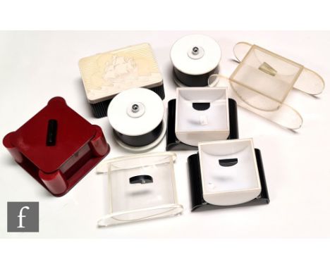 A collection of assorted early 20th Century plastic items, to include a lidded box of square form with column details to the 