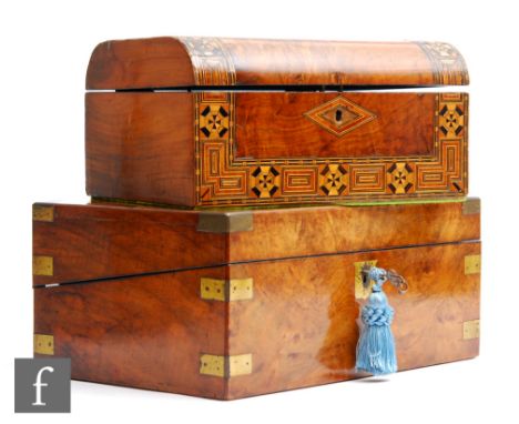 A Victorian brass bound walnut veneered writing slope, opening to reveal a blue leather writing surface, inkwell, stamp well 