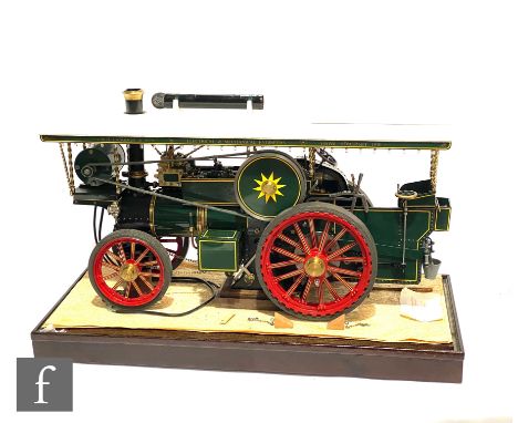 A freelance Showmans road locomotive based on a 1930s Fowler tractor, painted in green in BH Langdon &amp; Son livery, housed