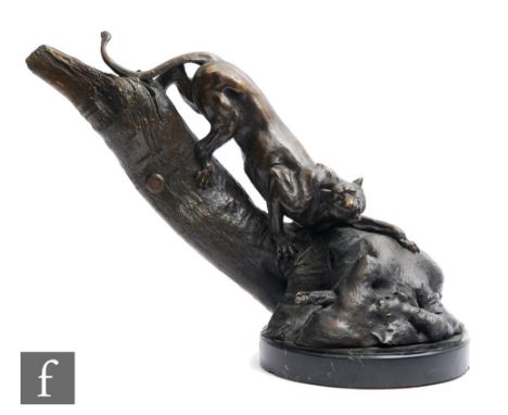 A later 20th Century French patinated bronze study depicting a prowling panther descending a tree stump, mounted to a circula