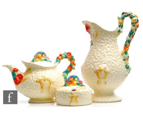 A Clarice Cliff, Newport Pottery Celtic Harvest jug&nbsp;of footed baluster form relief moulded with corn, fruit and foliage 