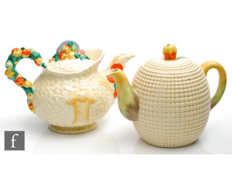 A large Clarice Cliff teapot in the Celtic Harvest pattern, relief moulded with fruit, foliage and wheatsheaves picked out in