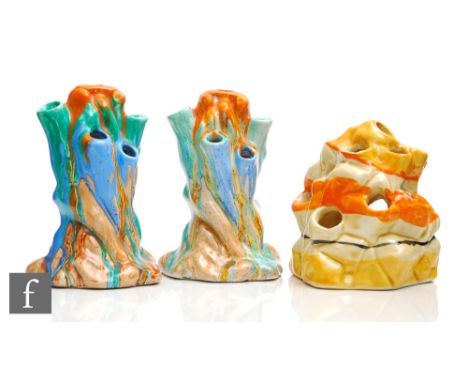 A pair of Clarice Cliff naturalistic flower blocks modelled as tree stumps, in the Delecia pattern, each hand decorated with 