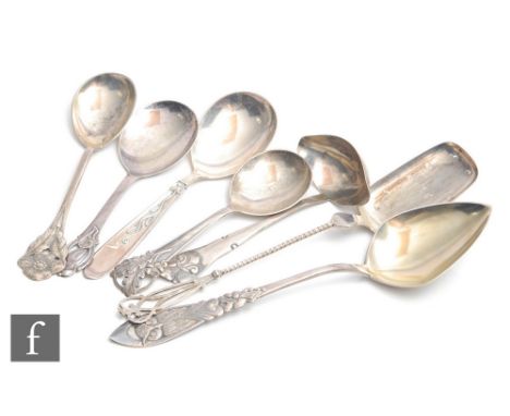 Seven assorted Danish silver spoons to include a ladle and a pierced serving example, total weight 13oz, largest 28cm, in len