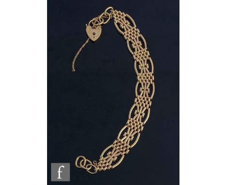A 9ct hallmarked five bar fancy gate bracelet weight 23g, terminating in padlock fastener. 