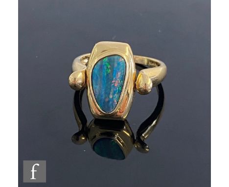 A 14ct swivel ring with collar set opal to one side and a cushioned rectangular mother of pearl panel to the other, weight 5.