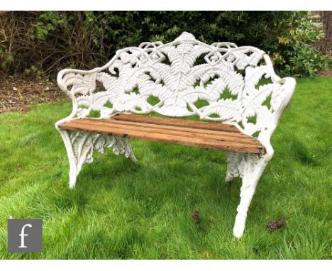 A 19th Century cast iron two seat garden bench in the fern and blackberry pattern, probably Coalbrookdale, with later slatted