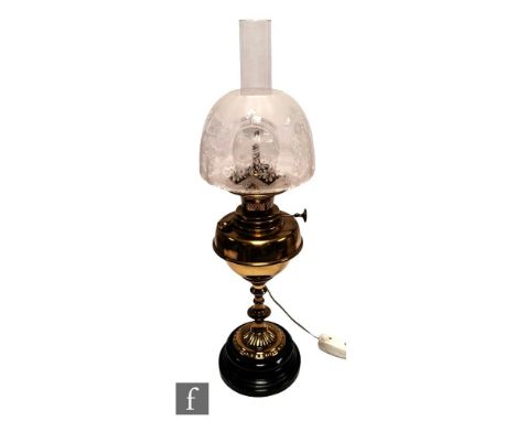 A Victorian style brass oil lamp with floral etched shade and chimney, converted, height 53cm. 