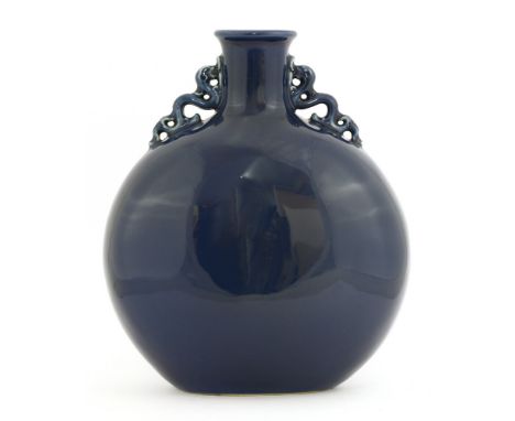 A Chinese porcelain moon flask, with two chilong handles to the shoulder, all under a blue glaze, 31cm high 霁蓝釉螭龙耳抱月瓶