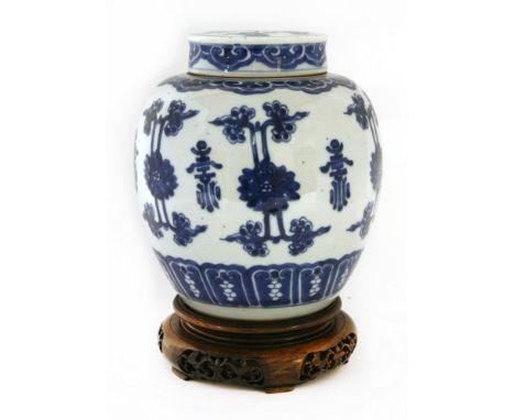 A Chinese blue and white jar and cover, 18th century, painted with scrolling lotus between shou characters, all between a ruy