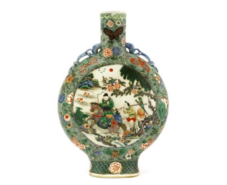 A Chinese famille verte moon flask, 19th-20th century, painted with figures below a pine tree in a roundel, the reverse with 