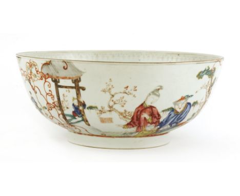 A Chinese famille rose punch bowl, 18th century, of circular form, painted with a man in yellow robe reaching out from a wind
