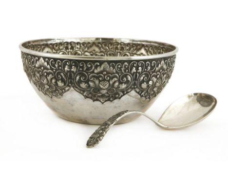 A Thai silver bowl, of circular form, with a border decorated with flowers in relief, stamped mark LKB.800, 24.3cm diameter, 