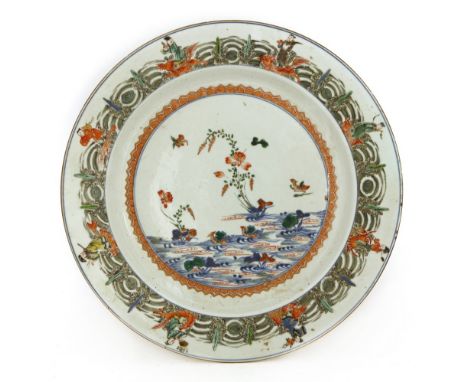 A Chinese wucai charger, Kangxi (1662-1722), the centre painted with mandarin ducks in a lotus pond, the border painted with 