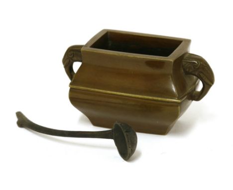 A Chinese bronze water dropper, 19th century, in the form of an incense burner, of tapering rectangular form, two elephant ha
