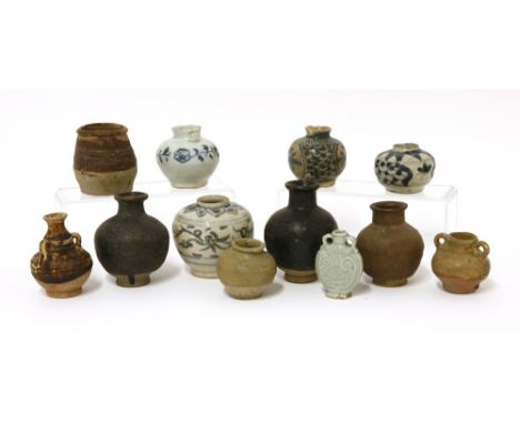 A collection of Chinese jarlets, Song to Ming dynasty, 4 to 8cm, including a blue and white example with loop handles, Yuan d