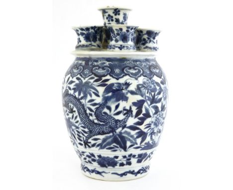 A Chinese blue and white bulb vase, c.1900, with six openings, decorated with dragons amongst flowers below a ruyi shaped bor