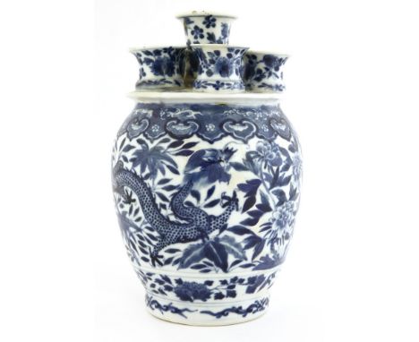 A Chinese blue and white bulb vase, c.1900, with six openings, decorated with dragons amongst flowers below a ruyi shaped bor