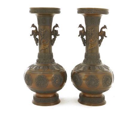 A pair of Japanese bronze vases, Meiji period (1868-1912), each of globular form on a circular stepped foot with a long neck 