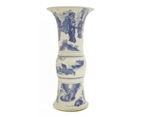 A Chinese blue and white gu vase, Kangxi (1662-1722), the top section painted with figures in a sitting room, the centre sect