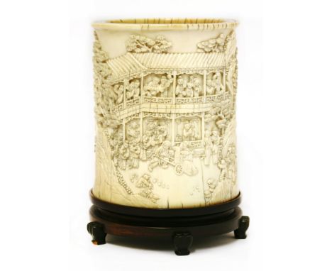 A Chinese ivory brush pot, Qianlong (1736-1795), of cylindrical form, deeply carved with the extraordinarily handsome Pan Yue