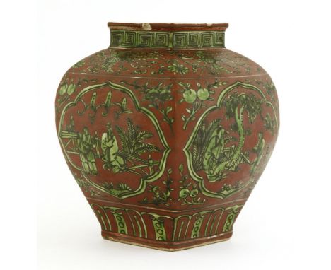 A Chinese jar, of tapering square form, painted in green enamel with figures in a garden in shaped panels surrounded by flore