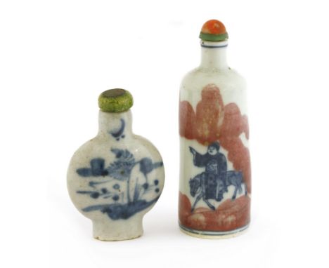 Two Chinese snuff bottles, 20th century, one blue and white decorated with an official seated on the back of a horse, and a f