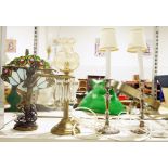 Art Nouveau-style table lamp with a figure of a ballerina and a Tiffany-style shade behind, an oil