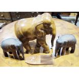 Large carved wooden elephant and two smaller wooden elephants, and a wooden carved comb (1 box)