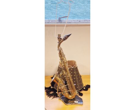 Vintage Majestic saxophone adapted for electricity and mounted as a table lamp on black marble base, marked MAJESTIC/ Eb HP/1