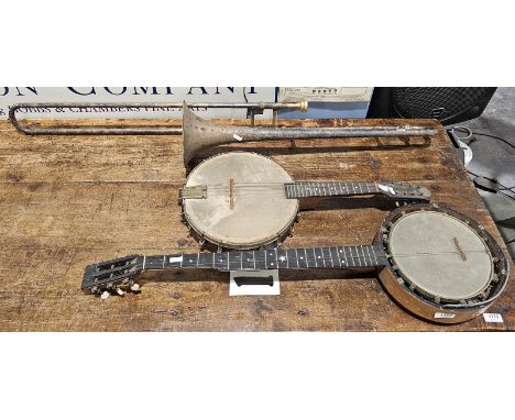 Two vintage banjos and a trombone