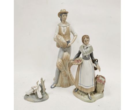 Large Miquel Requena (Valencia) porcelain figure of a farmer standing before wheat sheaves, a figure of a lady vintner simila