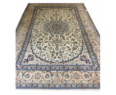 FINE PART SILK PERSIAN ISFAHAN DESIGN CARPET, 338cm x 220cm polychrome medallion and scrolling vines on ivory field.