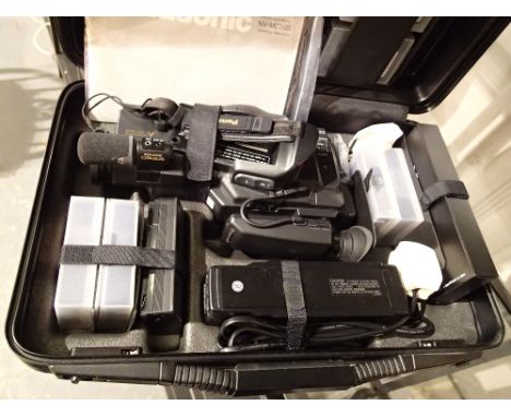 Panasonic NV-MC30B VHS compact movie camera and accessories in case 
