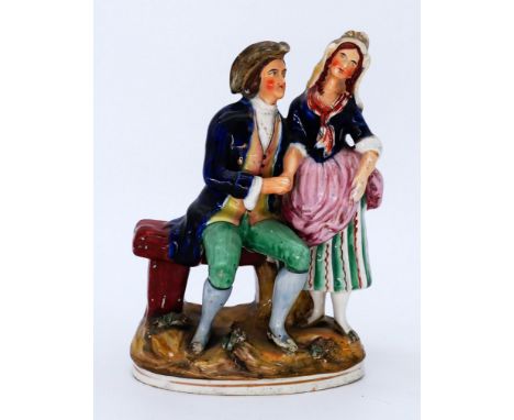 HISTORICAL: An Staffordshire Pottery Group Figure, modelled as the Proposal, mid 19th century,he seated on a bench or stile, 