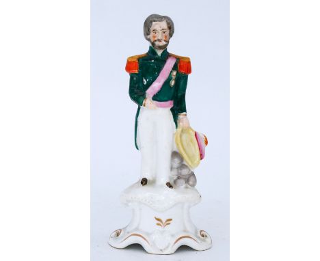 MILITARY: A Staffordshire Pottery Portrait Figure, modelled as Sir Henry Havelock, mid 19th century,  standing in uniform wit