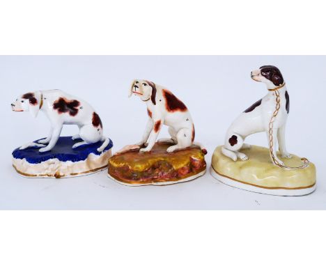DOGS: Three delightful small Staffordshire Foxhounds, circa 1830-50, attributed to the Dudson Factory,  including a seated an