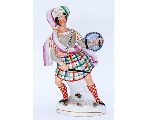 SCOTTISH: A Staffordshire Pottery Flatback Portrait Figure, modelled as William Wallace, mid 19th century,  standing 'en guar