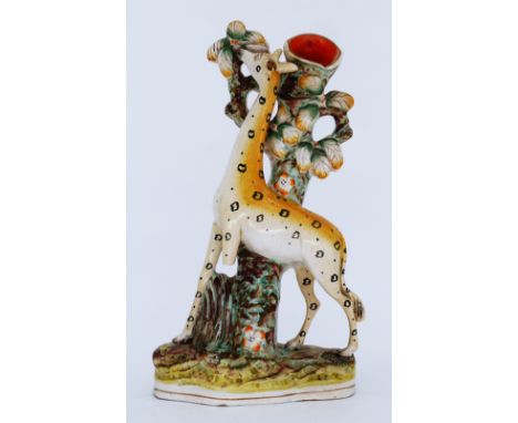 ANIMALS: A rare Staffordshire Pottery Flatback Spill Vase, modelled as a Standing Giraffe, mid 19th century,  standing before
