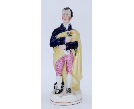 MILITARY: A rare and unusual Staffordshire Pottery Portrait Figure, modelled the Duke of Wellington,  standing in a blue jack