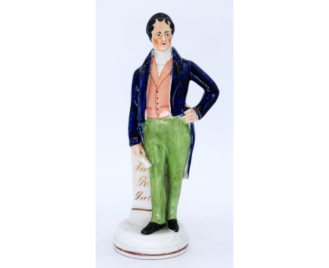 HISTORICAL: A fine Staffordshire Pottery Portrait Figure, modelled as Sir Robert Peel, mid 19th century,  standing in a blue 